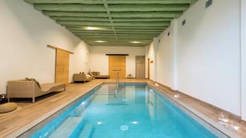 Indoor pool, open 9:00 AM to 11:00 PM, pool loungers
