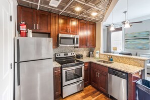 Fridge, microwave, oven, stovetop - Stunning Apartment with Bay Street Views and Parking by Lucky Savannah (Savannah)