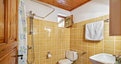 Cosy cottage with large veranda and garden with hammock near the beach.