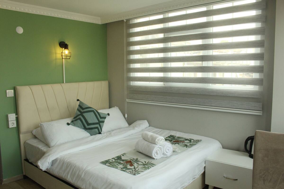 Desk, laptop workspace, blackout curtains, iron/ironing board