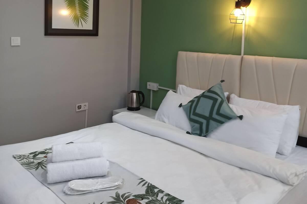 Desk, laptop workspace, blackout curtains, iron/ironing board