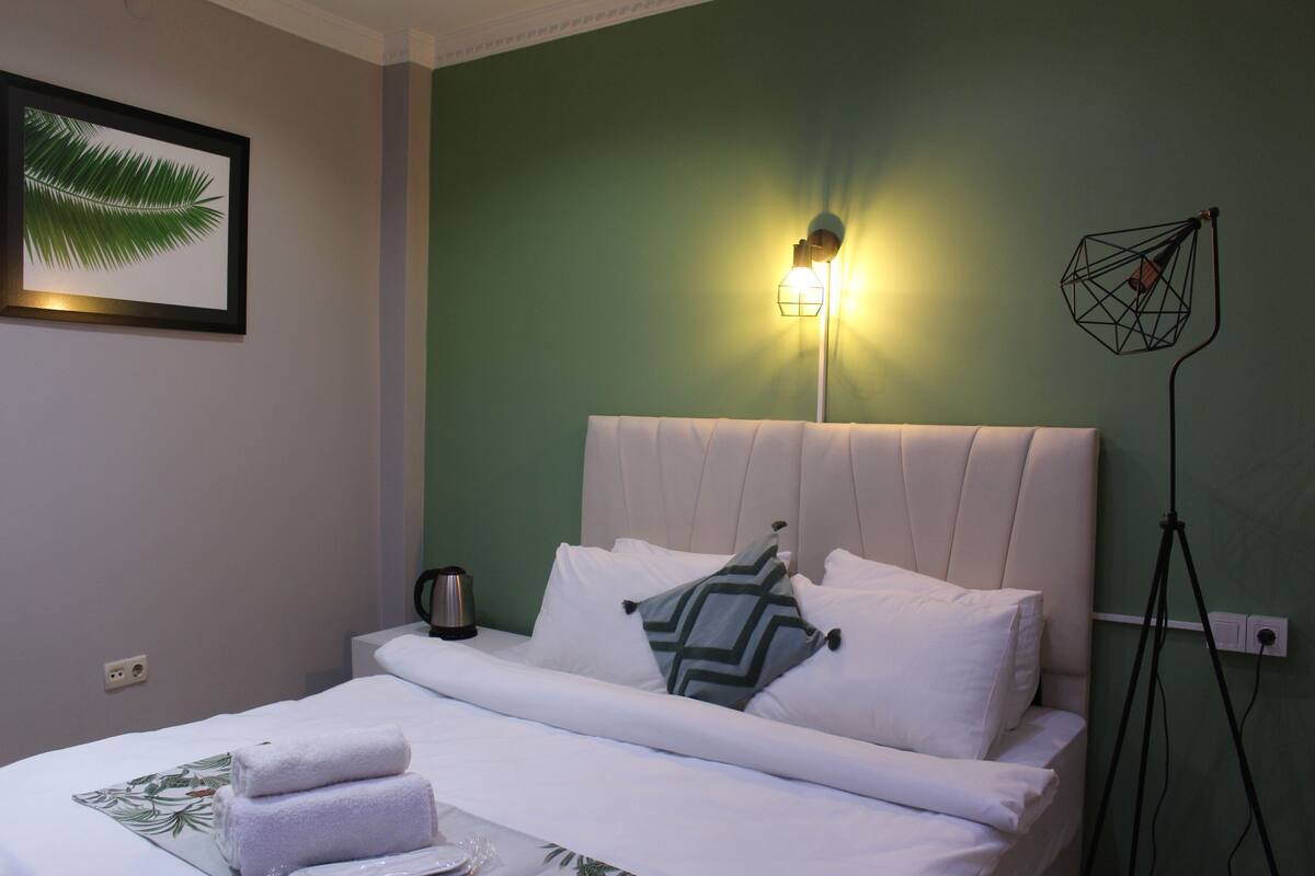 Desk, laptop workspace, blackout curtains, iron/ironing board