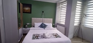 Desk, laptop workspace, blackout curtains, iron/ironing board