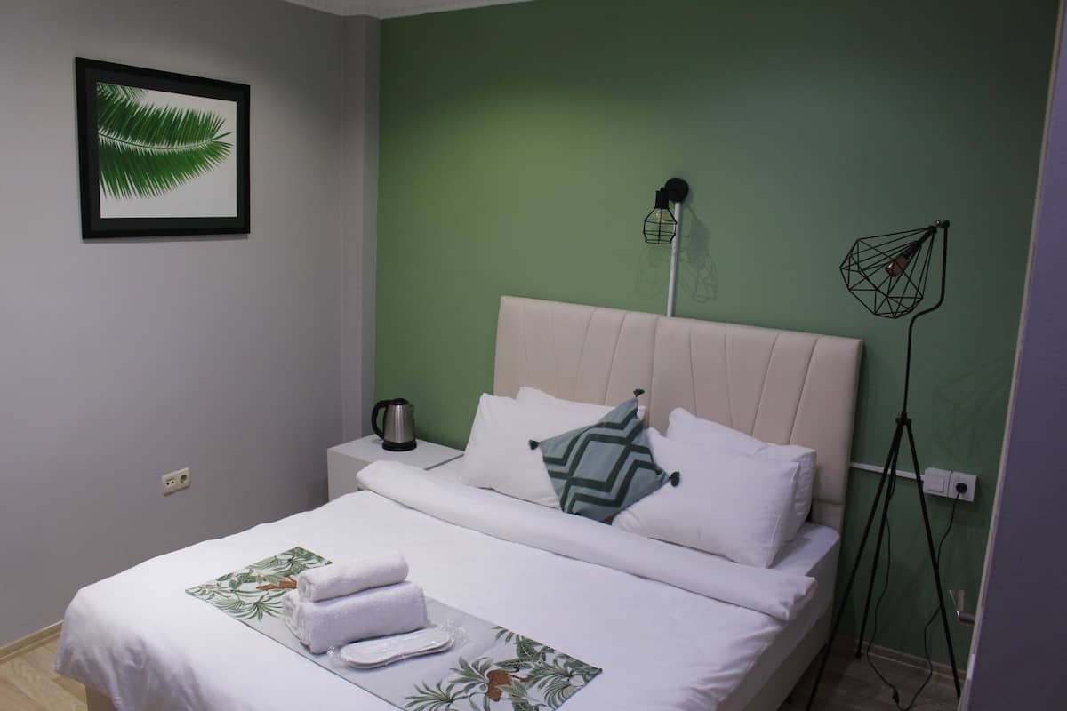 Desk, laptop workspace, blackout curtains, iron/ironing board