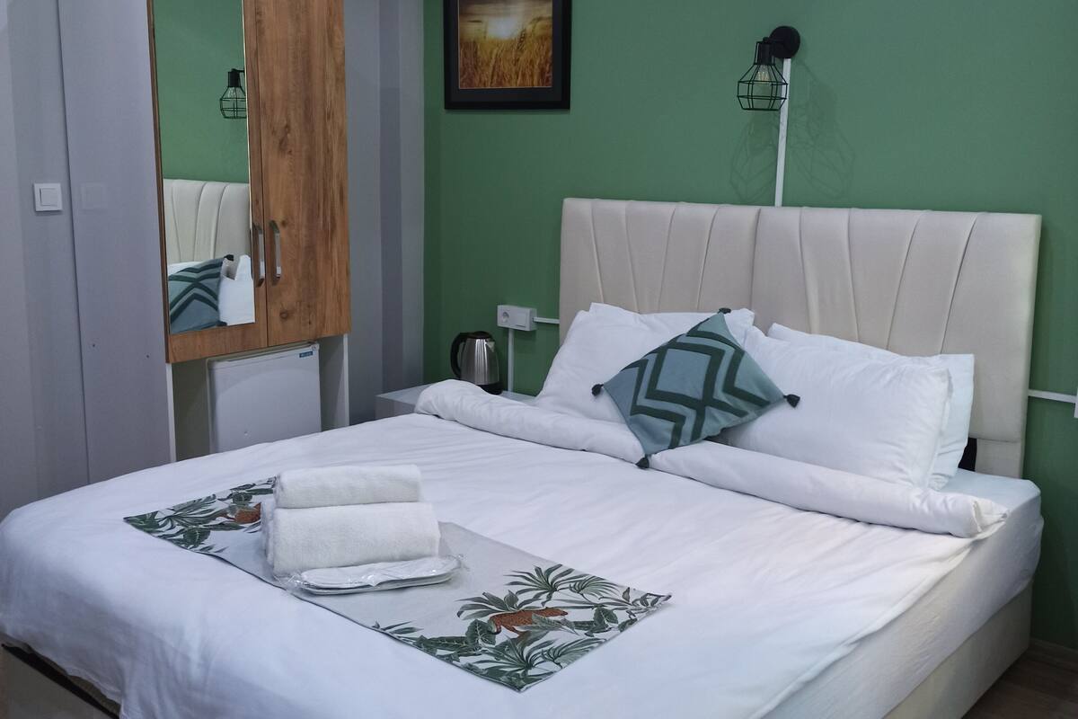 Desk, laptop workspace, blackout curtains, iron/ironing board