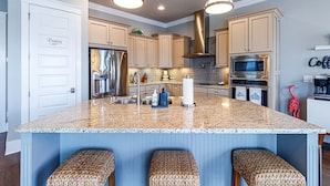 A kitchen with a large island, stainless steel appliances, and a 'Pantry' sign. - Starfish Waterfront Family Retreat, Steps to Sound (Navarre)