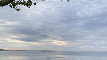 On the beach, sun-loungers