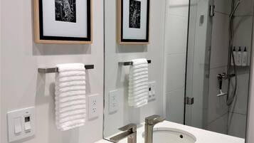 Shower, hair dryer, towels, soap