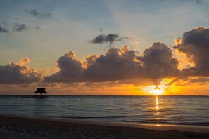 On the beach, white sand, free beach cabanas, sun loungers