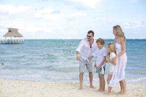 On the beach, white sand, free beach cabanas, sun loungers
