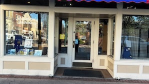 A storefront with a blue awning labeled "The Birthplace of Pepsi Cola." - Getaway Country Cottage - Entire house - Unique Find /Outdoor Decking           (New Bern)