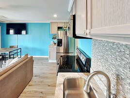 Condo, Multiple Beds, Balcony, Beach View (#B303 - No Pets) | Private kitchen | Fridge, microwave, oven, stovetop