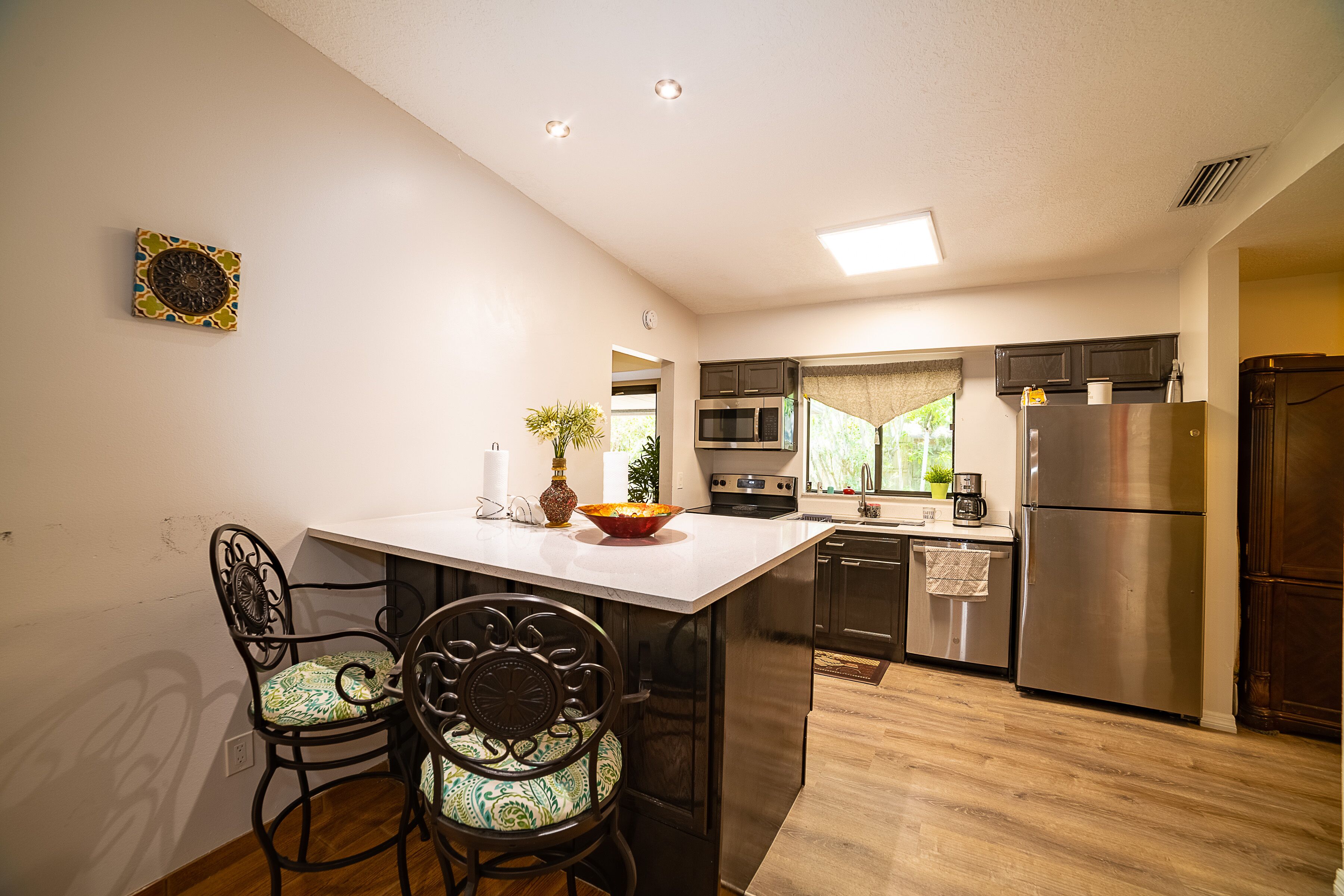 Fridge, microwave, stovetop, coffee/tea maker