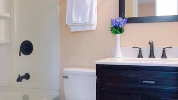 Combined shower/tub, towels, soap, toilet paper