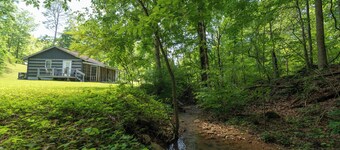 Moonshine Cabin with a nice yard on the creek in the shadows of the Smokies