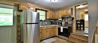 Moonshine Cabin with a nice yard on the creek in the shadows of the Smokies 