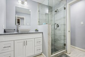 Combined shower/tub, hair dryer, towels, soap