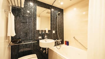 A modern bathroom with a white sink, a large mirror, a bathtub, and a shower.