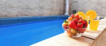 House with pool near waterfall