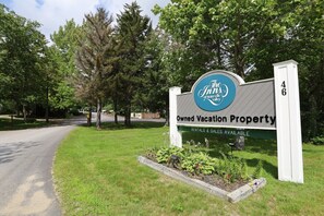 A sign for The Inn of Waterlie Valley, indicating it is an owned vacation property with rentals and sales available. - Spend your Vacation at Waterville Valley! (Waterville Valley)
