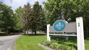 A sign for The Inn of Water Valley, indicating it is an owned vacation property with rentals and sales available. - One Bedroom at Inns of Waterville Valley (Waterville Valley)