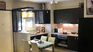 Deluxe Apartment, 1 Bedroom | Living area | 50-inch flat-screen TV with cable channels, TV