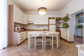 Enjoy meals and casual gatherings in this kitchen with a central island, seating, and microwave.