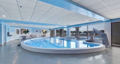 Lake Charlevoix Views with Walkout Patio | Pool, Hot Tub, Sauna | Fireplace