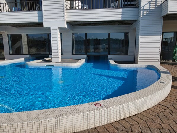 A modern building with a swimming pool.