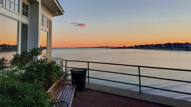 A waterfront view with a bench and trash can. - 3 bedroom condo nestled in Historic fishing village - dog friendly (Swampscott)