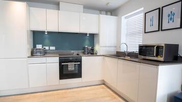 Design Apartment, Accessible, Ensuite (Orchard Point) | Shared kitchen