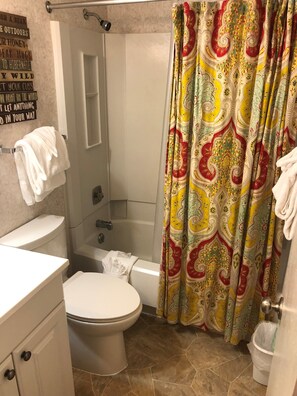 Combined shower/bathtub, hair dryer, towels, soap