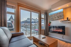 TV, fireplace - Top-Floor Condo | 2BR + AC with Mountain Views (Canmore)