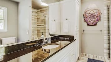Combined shower/tub, hair dryer, towels, soap