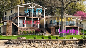A three-unit house with a covered porch, a laundry area, and a view of a river. - JOMO - Unit 2 TriTerrace *Relax Lakefront *Enjoy Fam (Rocky Mount)