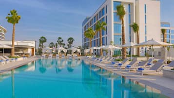 Outdoor pool, pool umbrellas, sun loungers