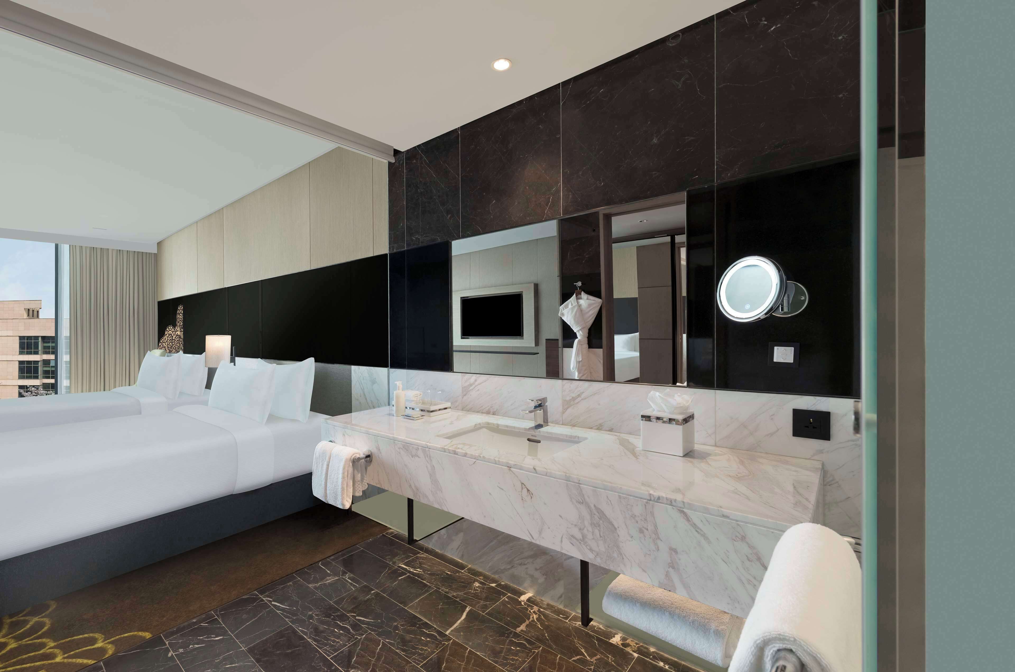 Designer toiletries, hair dryer, bathrobes, slippers