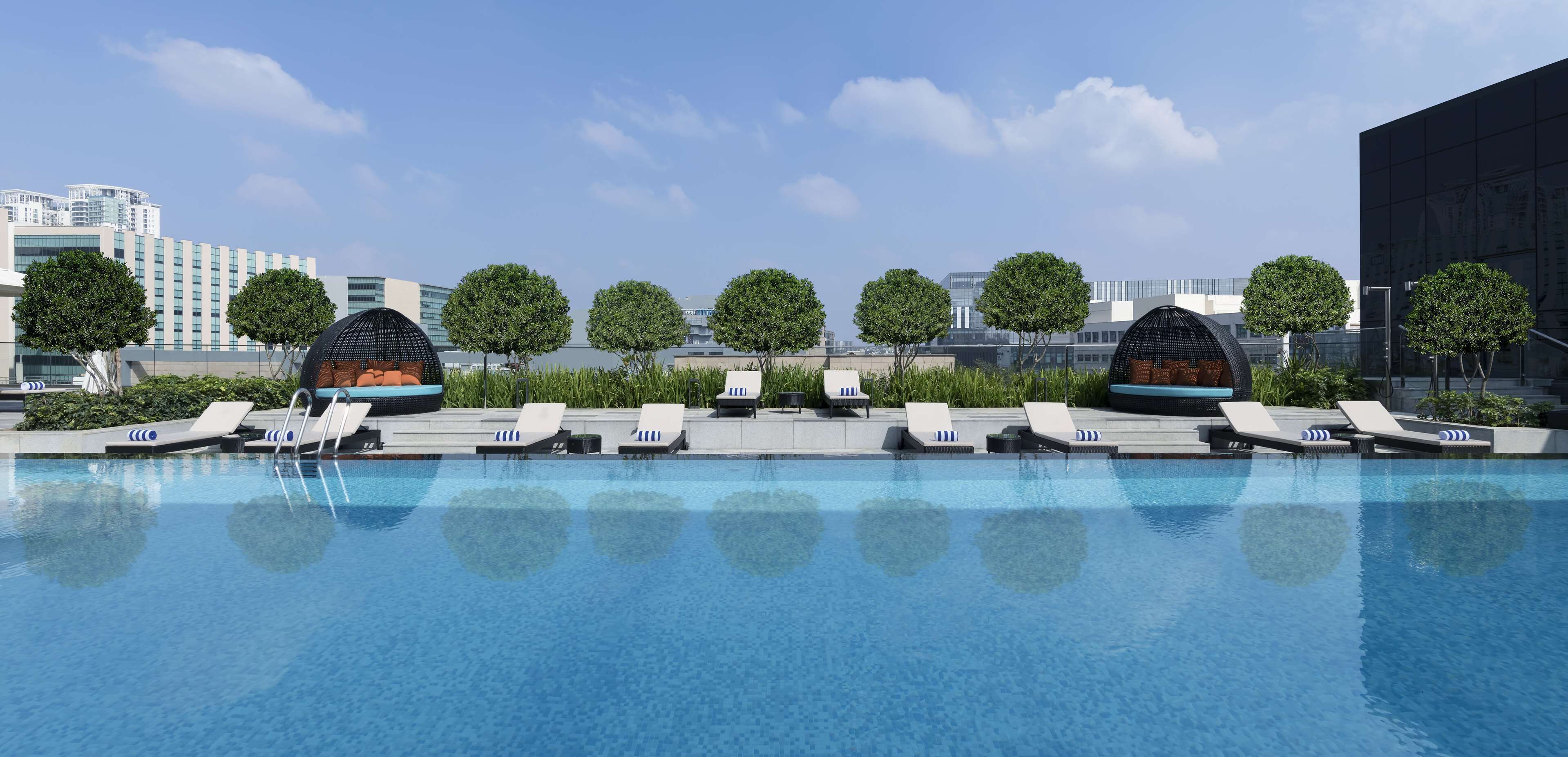 Outdoor pool, open 6:00 AM to 7:00 PM, free pool cabanas