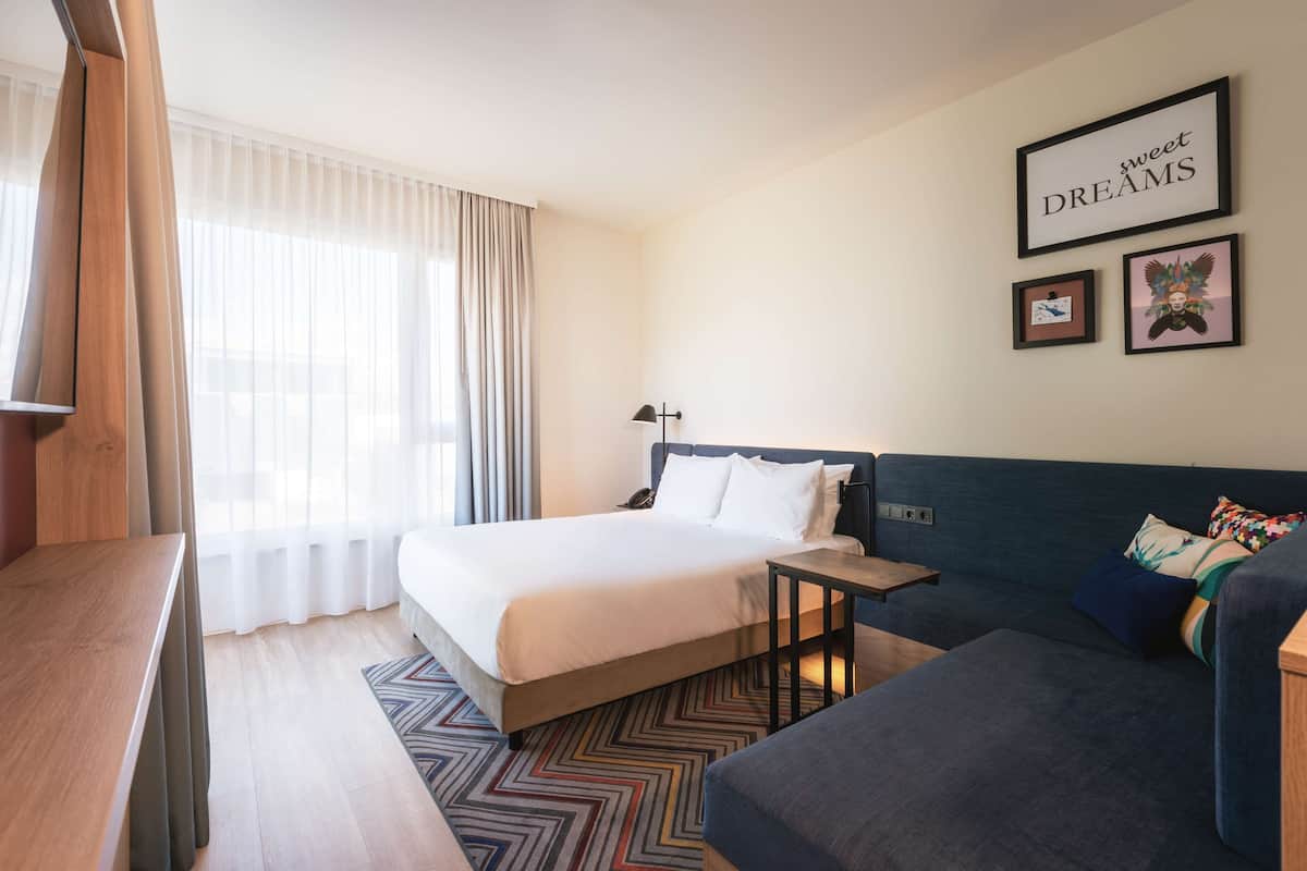 Standard Room, 1 Queen Bed with Sofa bed | Living area | 49-cm flat-screen TV with digital channels, TV