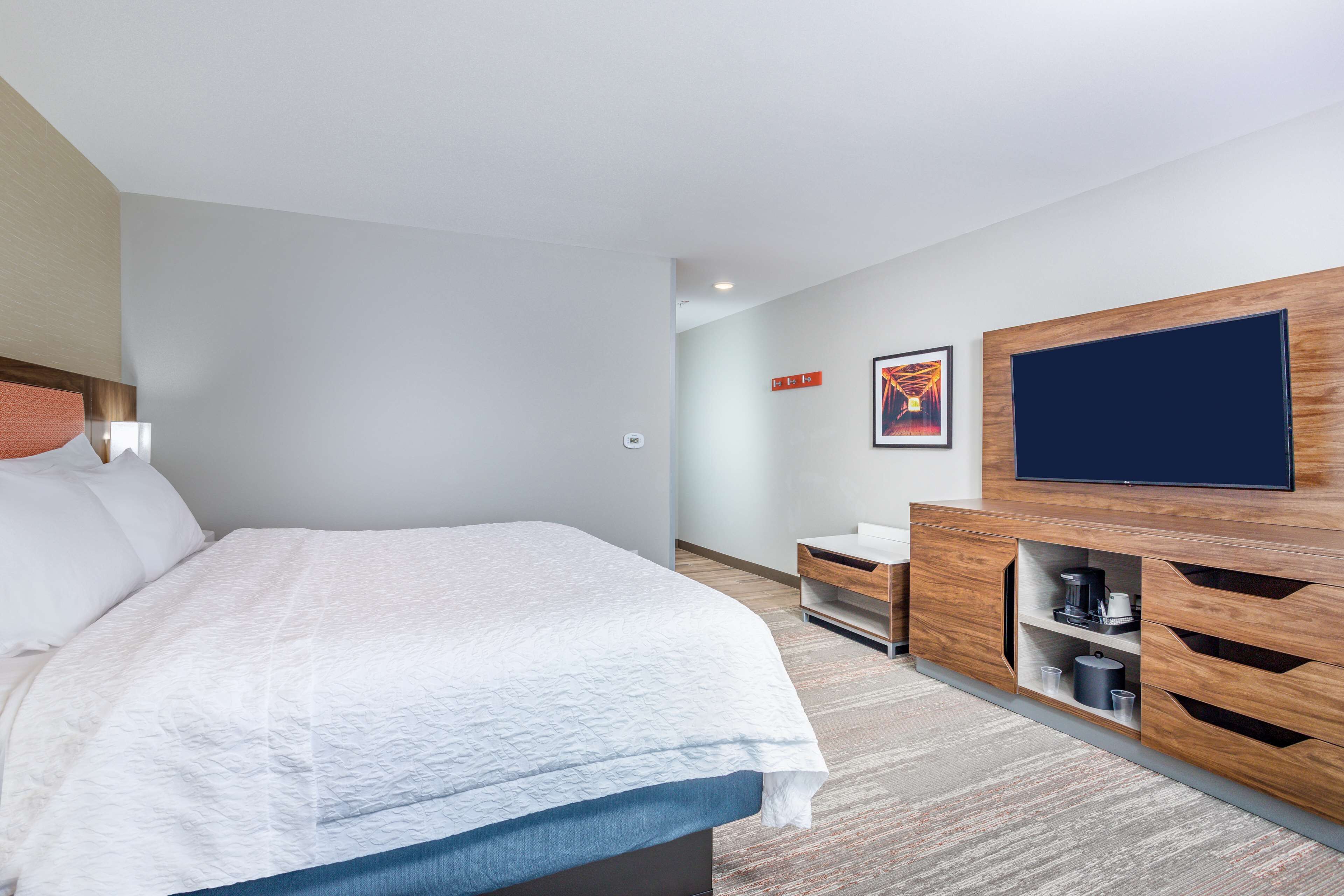 pillow-top beds, desk, laptop workspace, blackout curtains