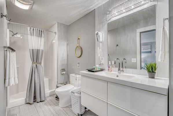 Shower, hair dryer, towels, soap