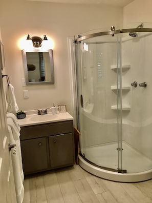 Combined shower/tub, hair dryer, towels, soap