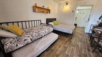 Family Room, Multiple Beds | Individually decorated, laptop workspace, bed sheets