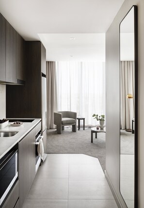 Deluxe appartement, 1 slaapkamer | Privékeuken | Een espressoapparaat, een koffiezetapparaat/waterkoker