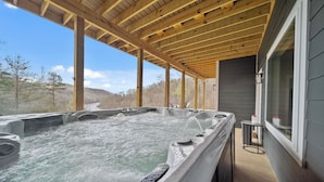 A hot tub area with wooden beams and a view of trees and hills. - Lakeview Home/Private Boat Dock/Hot tub/Golf Cart/Gameroom/Stunning Fall Views (LaFollette)