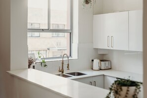 Fridge, microwave, oven, stovetop - Classy City apartment close to Beach. (Newcastle)