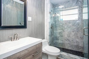 Bathtub, hair dryer, towels, soap