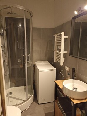 Bathtub, hair dryer, towels, soap