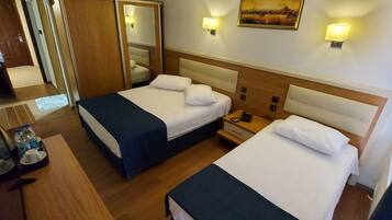 Standard Room, Multiple Beds, Non Smoking | Free WiFi, bed sheets