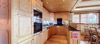 Living room with Swedish fireplace, open kitchen with vitroceram, dishwasher, Nespresso machine and